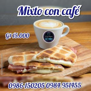 two waffle sandwiches on a cutting board next to a cup of coffee at El chalet del parana in Encarnación