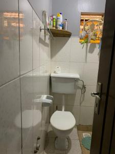 a bathroom with a toilet and a glass shower at Kylo cozy calm in Kampala +16 photos