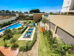Πισίνα στο ή κοντά στο Apt todo mobiliado 2 quartos e Office com Cama Alto Padrão Cuiabá
