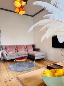a living room with a couch and a table at Eiszeit in Bitterfeld