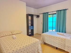 Postel nebo postele na pokoji v ubytování Villa Sagrado Corazón + 67 fotografií