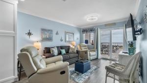 a living room with a couch and chairs at Plantation 4507 in Gulf Highlands