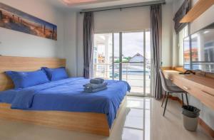 Ένα ή περισσότερα κρεβάτια σε δωμάτιο στο G sunflowe pool villa central +53 φωτογραφίες