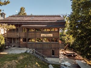 a large wooden house with a bench in front of it at Chalet Rosablanche, since 1929 - peace, quiet & tradition in Nendaz