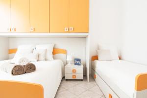 Postel nebo postele na pokoji v ubytování Alessia's Flat - Breno 1