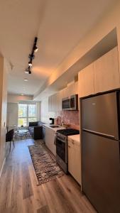 a kitchen with a stove and a refrigerator at Luxury Walk of Fame Studio in Los Angeles