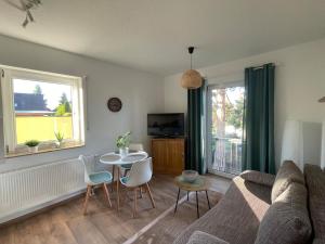 a living room with a couch and a table at At home Appartement in Gotha