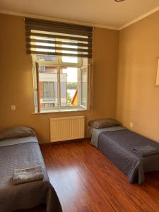 Ένα ή περισσότερα κρεβάτια σε δωμάτιο στο Apartament Main Street