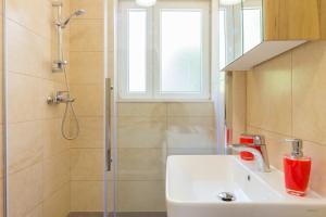 a bathroom with a sink and a shower at Apartment Di Maria in Dubrovnik +22 photos