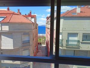 a view of the ocean from a window at Salvora in Bueu