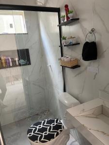 a white bathroom with a shower and a toilet at Rent for COP 30 in Belém! in Castanhal
