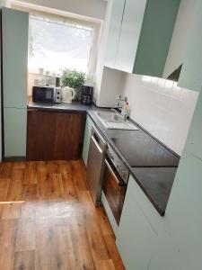 Η κουζίνα ή μικρή κουζίνα στο Large Central Apartment - MODERN & Fully Equipped - near fair