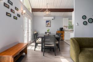 a kitchen and dining room with a table and chairs at Lounging in Long Pond in Long Pond