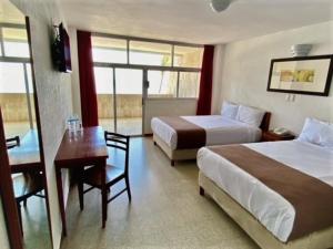 Postel nebo postele na pokoji v ubytování Hotel Royalty