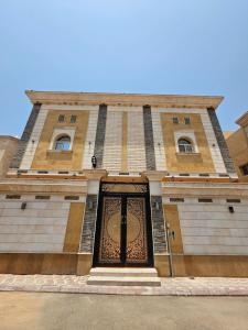a building with a gate in front of it at الشقق الفاخرة Modern Apartments of 3 Bedrooms 5 minutes to Haram in Al Madinah