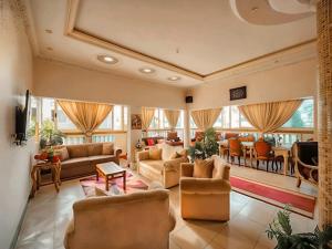 a large living room with couches and a dining room at Aqua Marina Ras ElBar in Ras El Bar