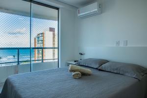 Postel nebo postele na pokoji v ubytování Apê com Vista Mar na Praia do Sul!