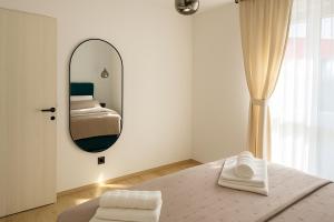 Ένα ή περισσότερα κρεβάτια σε δωμάτιο στο Olive & Wave Apartments- one minute to the beach