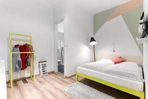 Posteľ alebo postele v izbe v ubytovaní The Magazine Hotel