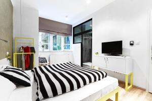 Posteľ alebo postele v izbe v ubytovaní The Magazine Hotel