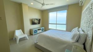 Ένα ή περισσότερα κρεβάτια σε δωμάτιο στο Magico Apartamento Frente al Mar 3 Habitaciones AR134