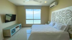 Ένα ή περισσότερα κρεβάτια σε δωμάτιο στο Magico Apartamento Frente al Mar 3 Habitaciones AR134