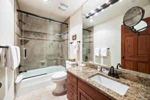a bathroom with a sink and a toilet and a shower at Serene Location, 2min to Deer Valley, 3BR townhome! Perfect for Ski & Summer Adventures! in Park City +24 photos