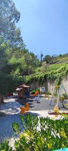a park with a playground with a swing at Lontano dal caos a due passi dal mare in Condrò