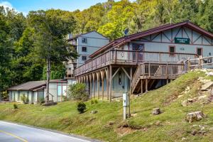 a house on a hill next to a road at The Highlands at Sugar in Banner Elk