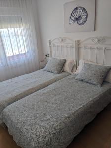 Ένα ή περισσότερα κρεβάτια σε δωμάτιο στο Apartamento Playa Rons