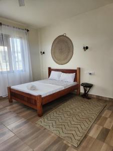 Postel nebo postele na pokoji v ubytování Almond Ridge diani villa 2