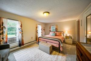 a bedroom with a bed and a window at 15 Mi to Penn State: Hideaway w/ Fire Pit! in Bellefonte