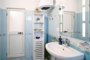 a bathroom with a sink and a mirror at Villa Balani in Široka +63 photos