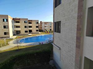 a view of a swimming pool from a building at شقة بقرية هلنان بورفؤاد in Chantier Island