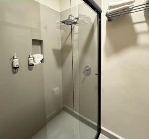 a shower with a glass door in a bathroom at Hotel Casa Santa María in Amealco