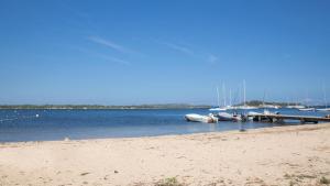 a group of boats docked at a dock in the water at Campo Di Mare in Porto-Vecchio