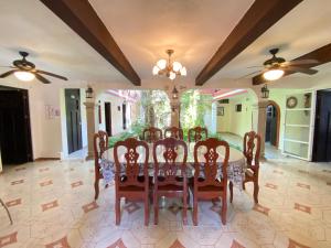 a dining room with a table and chairs at Quinta Marciala Hotel Boutique in Valladolid