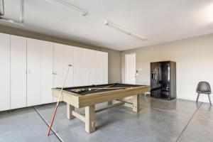 a pool table in a room with a ping pong ball at Multi-Million Dollar PGA West 4BR 5BA Pool Spa in La Quinta