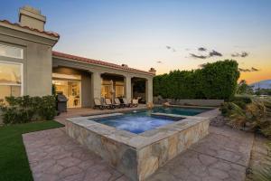 a swimming pool in the backyard of a house at Multi-Million Dollar PGA West 4BR 5BA Pool Spa in La Quinta +99 photos