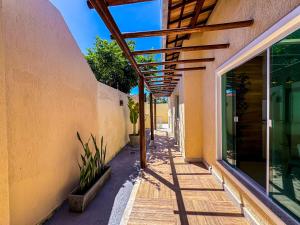 a hallway of a building with a walkway at Beach House Atalaia in Aracaju
