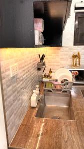 a kitchen with a sink and a counter top at Santa Cosy Villa B Fast Wi-Fi, Netflix Included Split system Air-con & Hot Shower in Santa Rosa