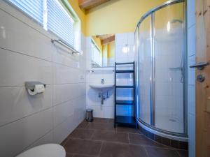 a bathroom with a glass shower and a sink at Mur-Chalet St Michael L in Sankt Michael im Lungau +19 photos