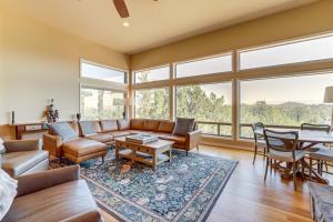 a living room with a couch and a table at Panoramic Views Luxe Payson Paradise! in Payson