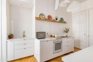 Η κουζίνα ή μικρή κουζίνα στο Beige Hospitalité - Apothéose Luxueux- 3 chambres - parking privé +25 φωτογραφίες