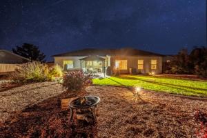 a home at night with a starry sky at Beautiful Family and Pet-Friendly Home Near National Parks with NEW Hot Tub in Kanab