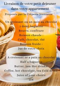 a picture of a plate of food with a bottle of orange juice at Beige Hospitalité - Emma - hypercentre - appart' unique-parking in Saint-Étienne +14 photos