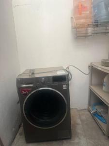 a washing machine in a corner of a room at Joyas Vallarta Coto Frente a Vidanta Worl in Jarretadera