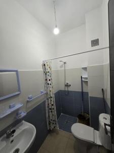 a bathroom with a sink and a shower and a toilet at Martil Riad Sofia in Martil +16 photos