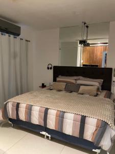 a bedroom with a large bed in a room at House in Condominium with Pool 20 min from COP30 in Ananindeua +1 photo