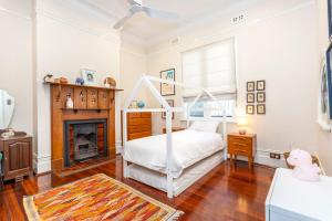 Ένα ή περισσότερα κρεβάτια σε δωμάτιο στο The Federation Cottage